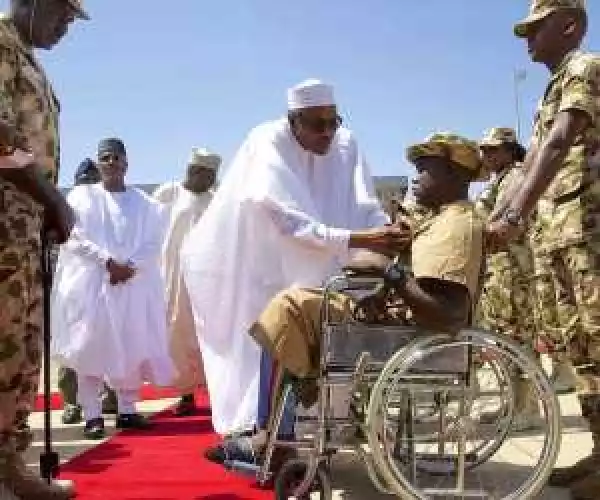 Photos: Buhari Decorates 3 Injured Soldiers With Purple Heart Medal